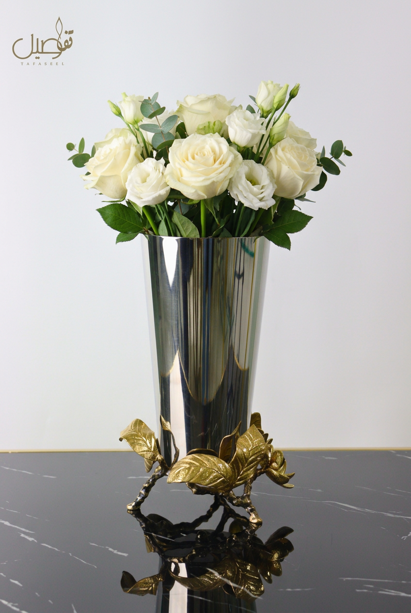 Silver vase with gold leaf base and fresh white flowers