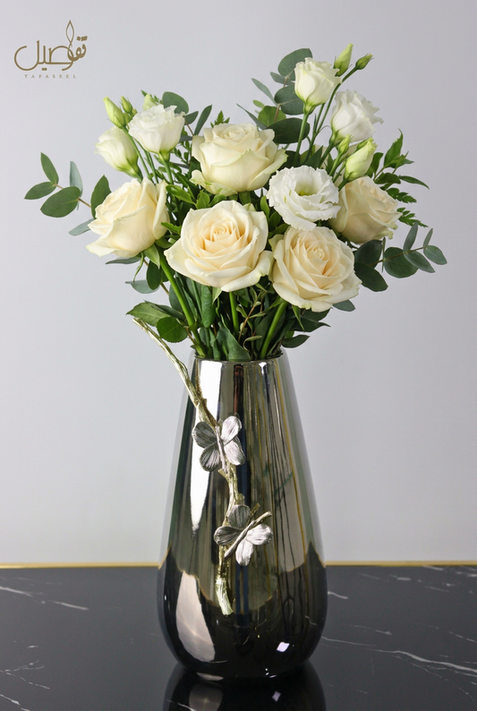 Vase styled with fresh white flowers